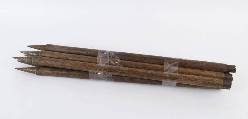 Set of six early 20th century cricket stumps, made from ash with brass tops and steel spikes at base, height 77cm. 
