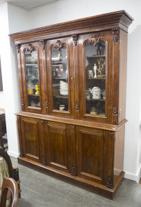 An English mahogany three door bookcase, 19th century, 220cm high, 182cm wide, 49cm deep