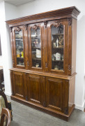 An English mahogany three door bookcase, 19th century, ​220cm high, 182cm wide, 49cm deep