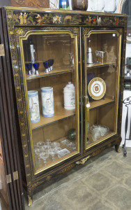 A French bookcase display cabinet with black Chinoiserie finish, circa 1920s, 173cm high, 140cm wide, 41cm deep