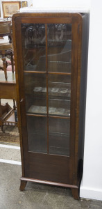 An Art Deco display cabinet, walnut, circa 1925, 138cm high, 46cm wide, 36cm deep