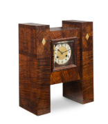 An Australian Art Deco mantel clock, English time and strike movement in a fine fiddleback blackwood case inlaid with pearl shell, circa 1930, ​42.5cm high