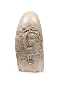 A scrimshaw whale's tooth finely carved with female portrait surrounded by ferns and roses with rope carved border, 19th century, ​14cm high