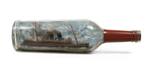 An Australian folk art ship in a bottle, late 19th, bottle stamped "The Federal Distilleries Pty. Ltd. Melbourne", Federal Distilleries were established in 1884 and conducted business from Port Melbourne, Victoria, 29.5cm long