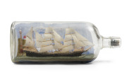 A clipper ship in a bottle, late 19th century, bottle embossed "IMPERIAL QUART", ​28.5cm long