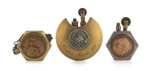 Three WW1 period trench art cigarette lighters, two set with English pennies the other German engraved "Verdun, March, 1918", (3 items), ​the largest 7cm high