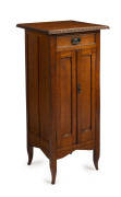 An Australian silky oak record cabinet, Queensland origin, circa 1920, ​interior fitted with numerous 10 inch and 12 inch compartments, 99cm high, 46cm wide, 44cm deep