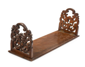 An Australian cedar bookstand with carved floral decoration, circa 1855, 14.5cm high, 40cm wide, 14cm deep