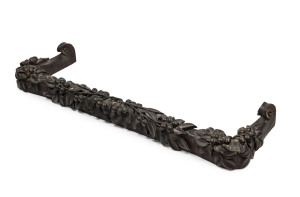 An Australian Arts and Crafts fire curb profusely carved with gumnuts and leaves, late 19th century, 144cm wide, 44cm deep