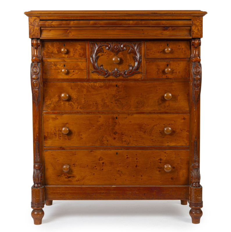 An Australian eight drawer chest with full length carved corbels, birdseye huon pine with kauri pine secondaries, 19th century, ​146cm high, 121cm wide, 61cm deep