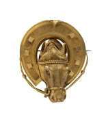 A superb Colonial Australian gold brooch fashioned as a horse's head surrounded by a horse shoe, most likely of Melbourne origin, 19th century, marks rubbed (illegible), 4.5cm high, 4cm wide, 18.5 grams