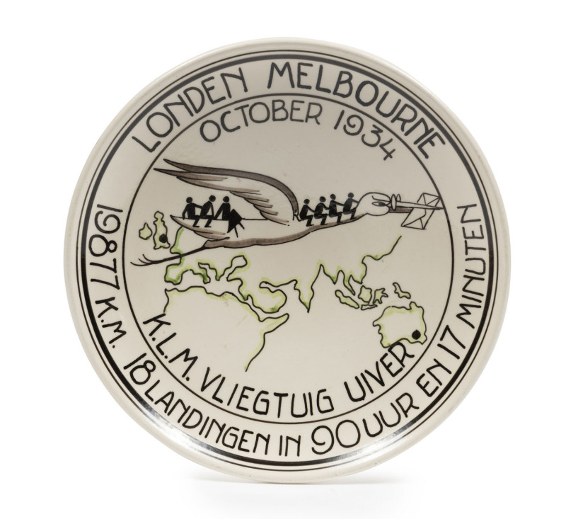 THE LONDON to MELBOURNE, MacROBERTSON CENTENARY AIR RACE 1934Porcelain hanging plaque by Koninklyk Goedewaagen Gouda (and numbered "183" on reverse), 18.5cm diameter; depicting a stork (Uiver in Dutch) carrying passengers and mail over the route from Lond