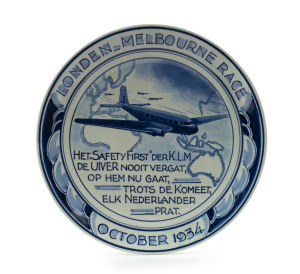 THE LONDON to MELBOURNE, MacROBERTSON CENTENARY AIR RACE 1934A Delft porcelain wall plaque, 18cm diameter, depicting the "Uiver" flying over a map of the route from London to Melbourne, superb condition with original hanging string still intact.