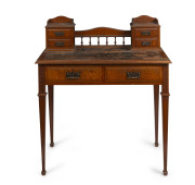 A lady's desk, carved silky oak with full silky oak secondaries, Queensland origin, circa 1890, 103cm high, 91cm wide, 58cm deep