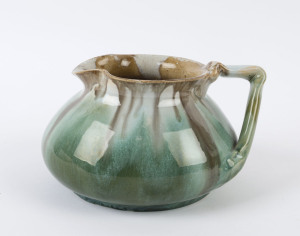 REMUED pottery jug with branch handle glazed in green, grey and brown, shape 173, (not signed), ​10cm high, 18cm wide