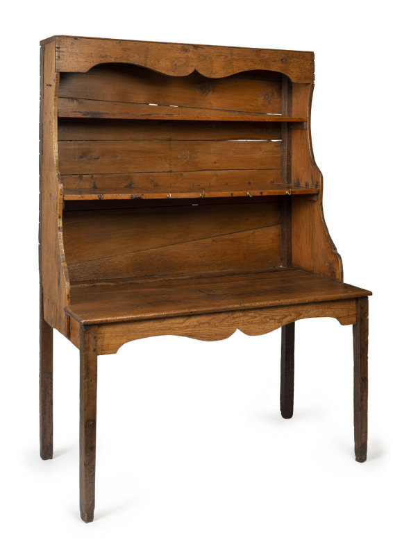 NED KELLY INTEREST. A primitive Australian open-front kitchen dresser with tapering square-form legs, eucalypt and pine, mid 19th Century, peg-joint construction, with original patination. Irregular cuts of timber used on the backing boards suggesting an