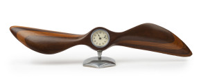 A timber propeller desk clock on chrome stand, circa 1940, 59cm wide