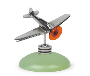 A chrome aeroplane desk ornament on green bakelite stand, circa 1940s, 12cm high, 14cm wingspan