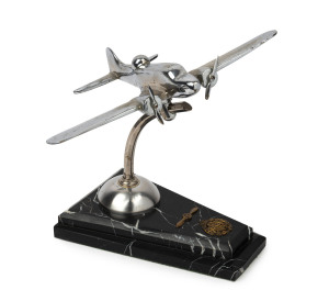 RAAF chrome aeroplane desk ornament on marble base with gilt metal decoration, circa 1940s, ​28cm high, 34cm wingspan