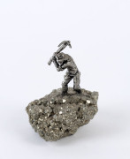 MIKE HAMMOND (attributed) Australian sterling silver mining statue mounted on mineral specimen, 8cm high