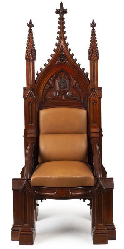 THE MODERATOR'S CHAIR REMOVED FROM SCOTS' CHURCH, COLLINS STREET, MELBOURNE An Australian cedar Gothic Revival Moderator's chair of lofty proportions, circa 1860. The two tapering column back posts with crocketed pinnacles and carved finials, flanking a c