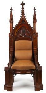 THE MODERATOR'S CHAIR REMOVED FROM SCOTS' CHURCH, COLLINS STREET, MELBOURNE An Australian cedar Gothic Revival Moderator's chair of lofty proportions, circa 1860. The two tapering column back posts with crocketed pinnacles and carved finials, flanking a central panel with carved motifs and Latin inscription (which translated reads) "And yet, It was Not Consumed". The hide covered seat is supported by flowing tracery and lancet arches with cluster-shafted buttress column legs. 200cm high, 82cm wi