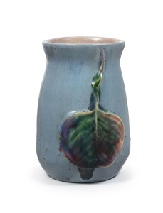 PHILIPPA JAMES pottery vase, blue glaze ground adorned with two applied gum leaves incised "Philippa James", 10.5cm high