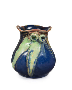 REMUED pottery vase, adorned with gum nuts and gum leaves, blue glazed ground with pink, green and yellow highlights, incised "Remued, Hand Made, 193LM", 13.5high, 12.5cm diameter