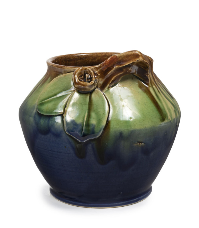 REMUED pottery vase with applied branch handle, gum nut and unusual shaped leaves, early incised decoration around the shoulder, glazed in blue, green and brown, incised "Remued", 13cm high, 13.5cm diameter