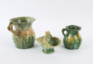 REMUED pottery basket vase and two branch handle vases, all glazed in green, branch handled examples incised "Remued", basket unsigned, the largest 16.5cm high