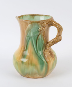 Australian pottery jug with branch handle, gum nuts and leaves, 21cm high