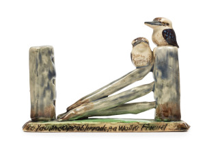 GRACE SECCOMBE pottery figural group of kookaburras on fence, inscription across base, no visible signature, 9.5cm high, 14cm wide
