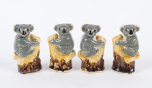 Grace Seccombe style group of four koala condiments, two stamped "Made in Japan", 8cm high
