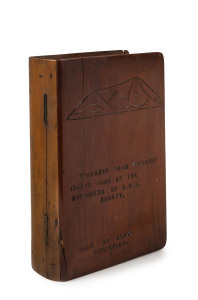 PITCAIRN ISLAND book box with stamped inscription "Souvenir From Pitcairn Island Home Of The Mutineers Of H.M.S. Bounty, Made By Clive Christian", with incised elevated view of the island, early 20th century, ​20cm high