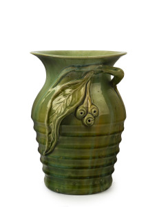 REMUED green glazed pottery vase with applied branch, gumnuts and leave, plus additional ribbed form,incised "Remued 196/9M",22.5cm high, 16cm wide