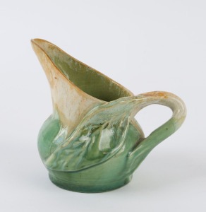 REMUED pottery jug with applied branch and leaf, no signature visible, ​11cm high, 12cm wide