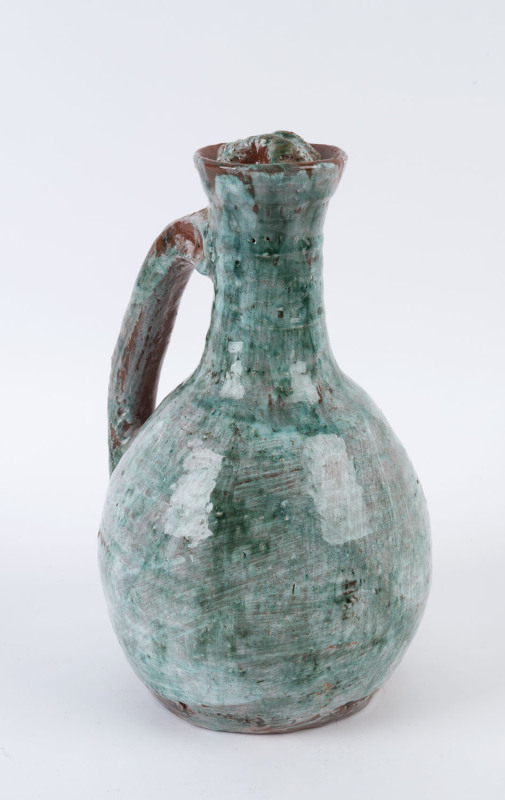 STANISLAV HALPERN green glazed pottery wine jug with stopper, signed "S. Halpern", ​30cm high