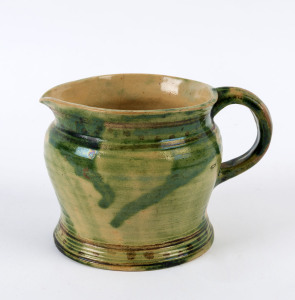 GOUGH green glazed pottery jug, signed under glaze "Gough", ​11cm high, 15.5cm wide