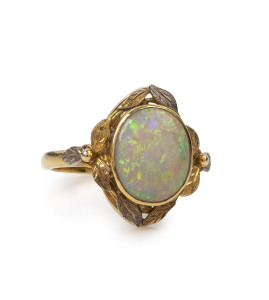 A 9ct gold and solid opal ring with white gold highlights, most likely the work of Rhoda Wager.