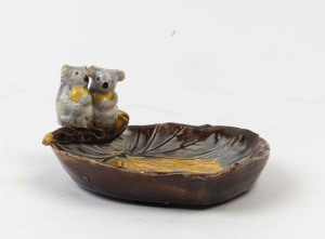 GRACE SECCOMBE pottery leaf dish with two koalas, incised "G.S.", 6.5cm high, 12.5cm wide