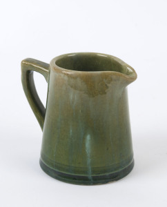 McHUGH green glazed pottery cream jug, incised "McHugh, Tasmania", 8cm high, 9cm wide