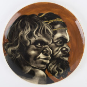 MARTIN BOYD pottery plate with Aboriginal father and son looking right, incised "Martin Boyd, Australia", 35.5cm diameter