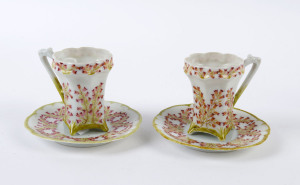 A pair of hand-painted cups and saucers, signed "E. MEYER", ​the saucers12.5cm diameter