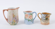 Three hand-painted porcelain jugs, signed "Ethel M. Good", "R. Carman" and one other (illegible), ​the tallest 11cm high