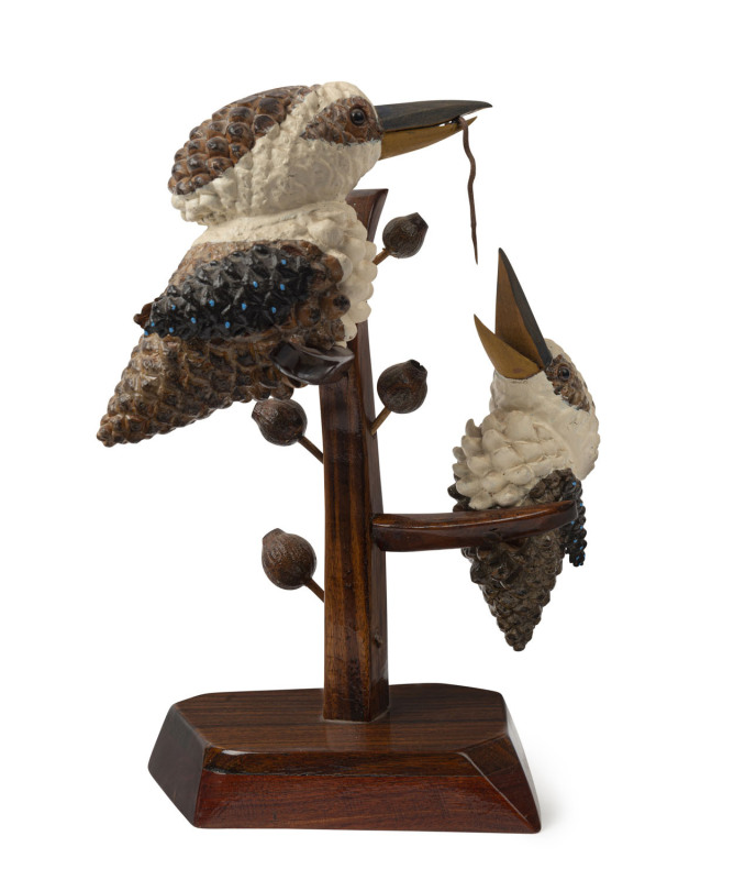 Folk Art kookaburra statue comprising of two kookaburras eating a worm, painted pinecones, gum nuts and blackwood, early 20th century, 36cm high