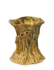 ERIC BRYCE CARTER pottery tree stump vase with applied gumnuts and leaves, incised "Eric Carter Sydney", 17cm high, 16cm wide