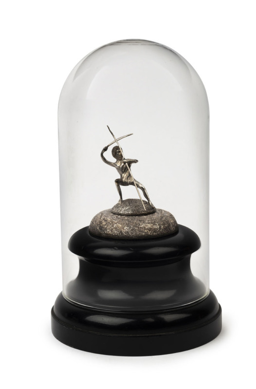 STEINER (attributed) Australian sterling silver statue of an Aboriginal warrior mounted on turned wooden base under glass dome, 19th century, stamped "STG. SIL." with crown and pictorial mark (illegible), 23cm high overall