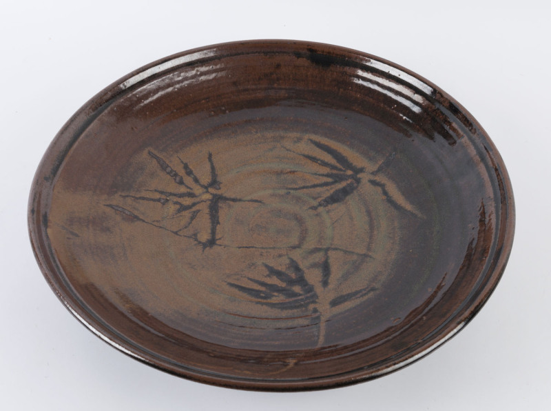 HAROLD HUGHAN early pottery charger, circa 1950s, with Glen Iris monogram. A near identical example is held in the N.G.V. (National Gallery of Victoria) collection. ​44.5cm wide