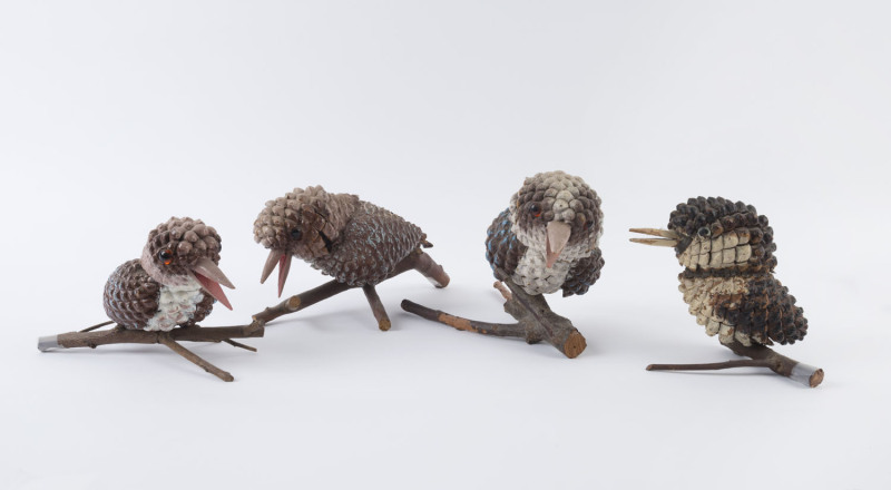 Group of four Folk Art kookaburra statues, painted pinecone and wood, early 20th century, the tallest 16cm high