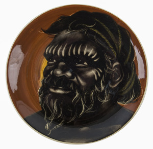 MARTIN BOYD pottery plate with male Aboriginal face, incised "Martin Boyd, Australia", 26cm diameter